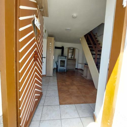 a hallway with a staircase in a house at Ferienparadies Haus Monica in Weikertsham