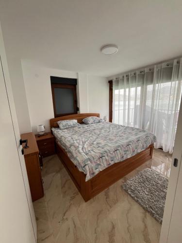 Postel nebo postele na pokoji v ubytování Apartman EM