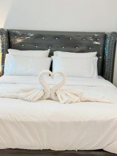 Postel nebo postele na pokoji v ubytování Service Apartment Lampang Room201 ที่พักใกล้กาดกองต้า
