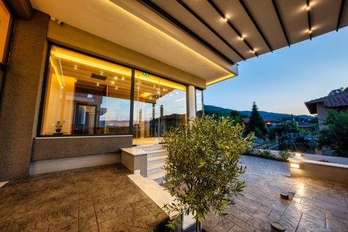 a house with a view of a patio at Lofos Luxury Living in Stavros