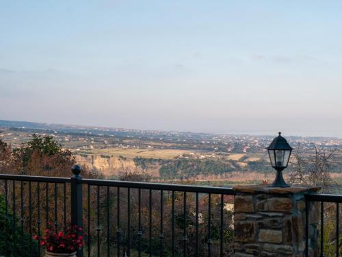 a street light on a fence with a view at Villa Dionisos in Skotína