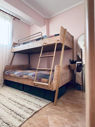 a couple of bunk beds in a room at Villa Mihaila in Ofrínion