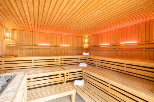 a large wooden lecture room with wooden benches in it at SEETELHOTEL Nautic Usedom Hotel & Spa das Hotel für Wellness & Genuss auf Usedom in Ostseebad Koserow