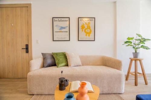 a living room with a couch and a table at Alba Gallery Suite in Quito