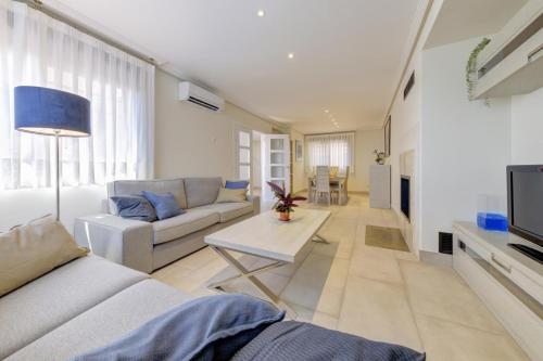 a living room with a couch and a table at El Palomar in Madrid