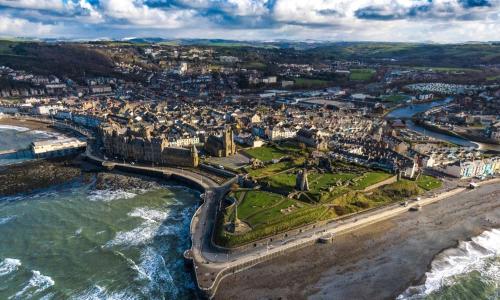 an aerial view of a city next to the ocean at Fisherman's Cottage in Aberystwyth