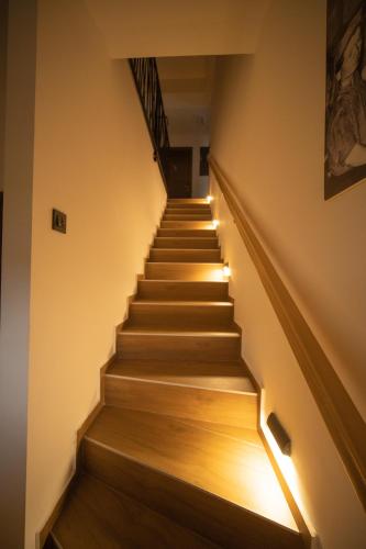 a staircase in a building with lights on it at Cantina rooms in Hum na Sutli