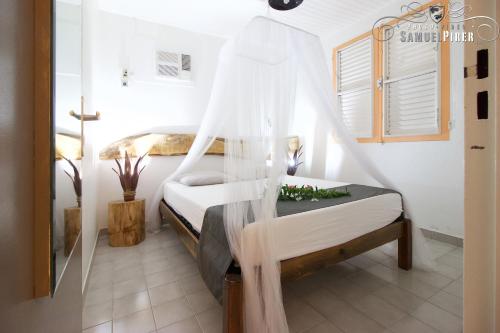 Postel nebo postele na pokoji v ubytování Orcéa & Spa Séjours Ecofriendly