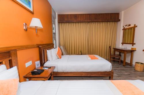Postel nebo postele na pokoji v ubytování Pokhara Batika