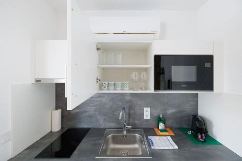 Η κουζίνα ή μικρή κουζίνα στο Ottakring Studio Apartment