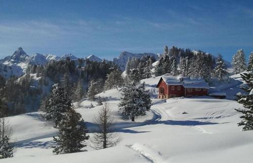 a house on top of a snow covered mountain at Ninette, intimità e natura in Sauze di Cesana