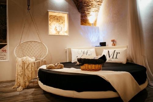 a bedroom with a bed with a basket on it at Casa Vacanze VENUS in Venosa