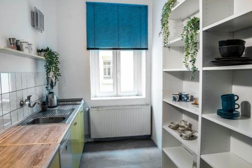 a kitchen with a sink and a window at Power Nap by Harmonia 24h self check-in in Poznań