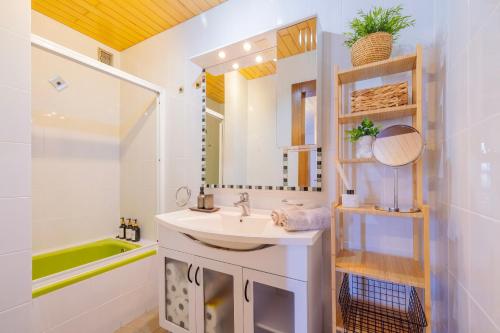 a bathroom with a sink and a mirror at Apartment Masa - FREE bikes in Premantura