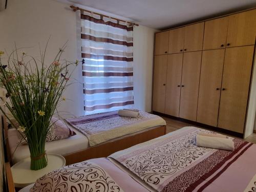Postel nebo postele na pokoji v ubytování Apartment Melanie