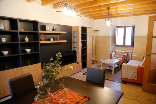 a living room with a couch and a table in a room at Casa Muiño dos Frades in Lourenzá
