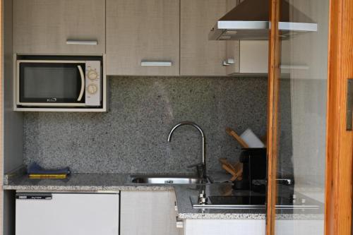 Kuchyň nebo kuchyňský kout v ubytování Apartament El Petit del Pla