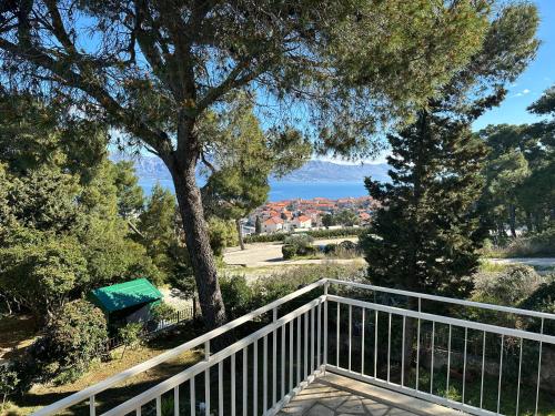 a balcony with a bench and a view of the water at "Silente" Cozy Two-bedroom Apartment with sea view in Postira