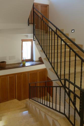 a staircase in a house with a window at Serra Cozy Apartments in Centola