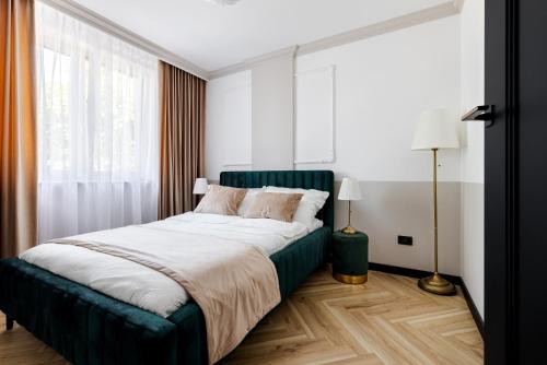 Ένα ή περισσότερα κρεβάτια σε δωμάτιο στο Apartament Diament