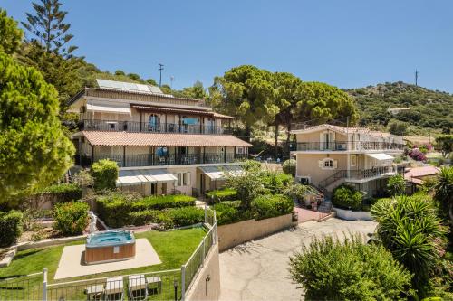 an image of a house with a garden at Irilena Studios and Apartments in Lassi