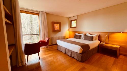 Cama ou camas em um quarto em Design Suites Bariloche