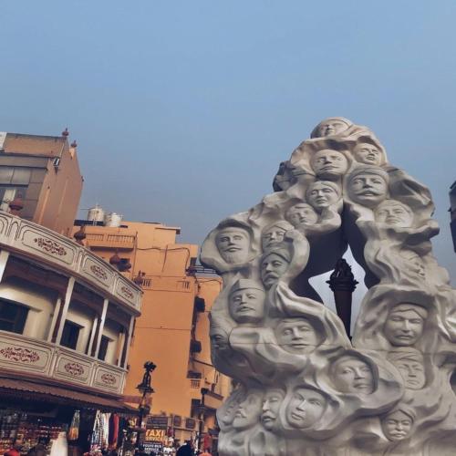a sculpture of faces on the side of a building at HOTEL JOGI GUEST HOUSE welcome all families, friends, groups, couples, singles fully Airconditioner, attach washrooms, lift, wifi, 24 hours room service, power backup in Amritsar