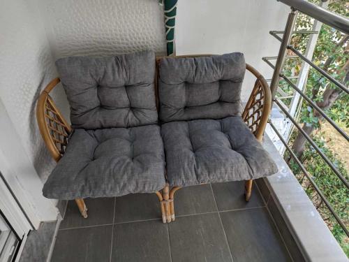 a chair sitting on top of a balcony at 2 bedroom apartment for 4 people 42m from the sea in Perea