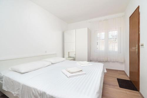 Postel nebo postele na pokoji v ubytování Apartment Ljuba
