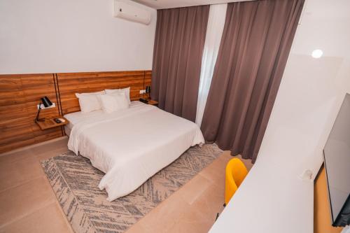 Ένα ή περισσότερα κρεβάτια σε δωμάτιο στο Hotel Marie Lucienne