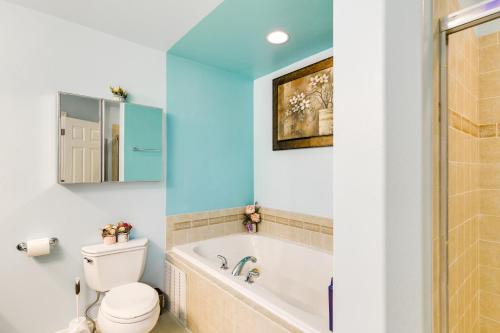 a bathroom with a tub and a toilet and a sink at Anchorage Home about 8 Mi to Downtown! in Anchorage