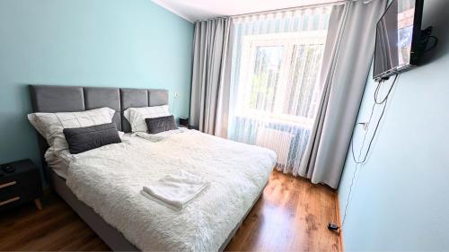 Posteľ alebo postele v izbe v ubytovaní Apartament Piernikowe Serce