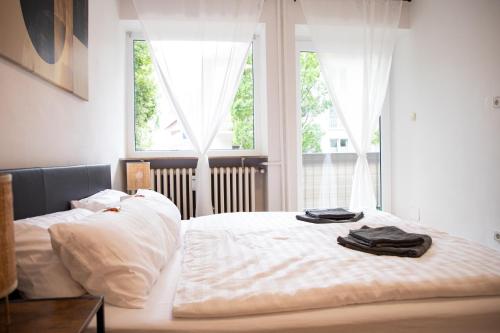 Кровать или кровати в номере ME LIVING Bad Pyrmont Innenstadt 10 Meter Balkon