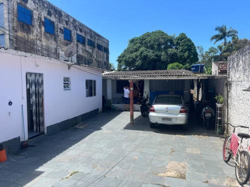a car parked in the garage of a house at Kitnet para Temporada na Praia Simples in Bertioga