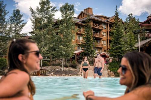 a group of people in the swimming pool at a resort at Reach Your Peak, Ski In, Ski Out, Pool, Hot Tub in Panorama