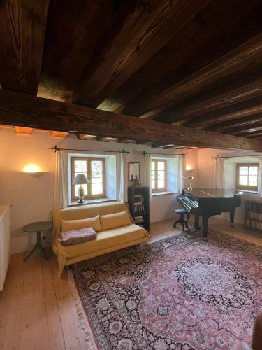 a living room with a couch and a pool table at Ferienhaus Malterlehen in Marktschellenberg