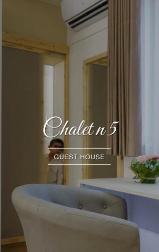 a room with a chair and a counter with a mirror at Chalet n5 Guest House in Catanzaro