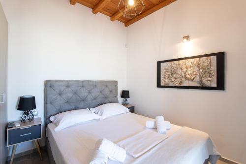 Ένα ή περισσότερα κρεβάτια σε δωμάτιο στο Miamis Villas Mykonos I