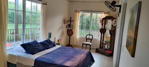 Ένα ή περισσότερα κρεβάτια σε δωμάτιο στο Villa Campestre Rivera