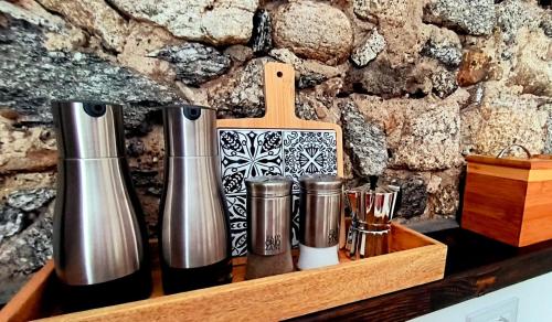 a wooden shelf with vases and cups on it at Villa Marchesa in Arona