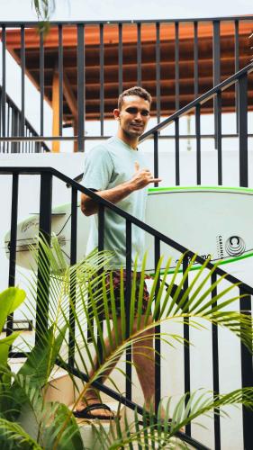 a man standing on a rail with a skateboard at Cafe Playa Negra Hotel in Playa Negra