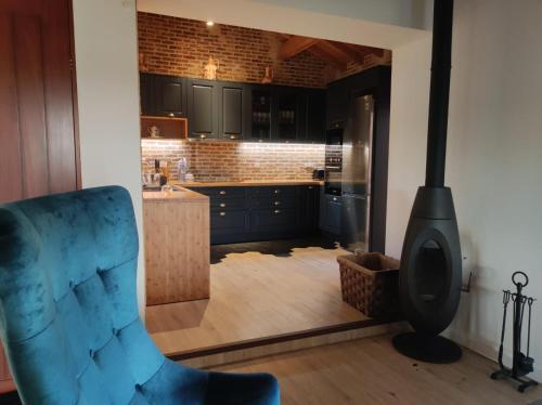 a kitchen with a stove in the middle of a room at Casa do Vô Sousa in Pombal