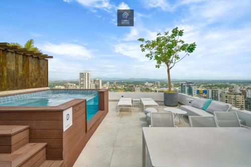 a swimming pool on the roof of a building at Monaco Residences Piantini in Santo Domingo