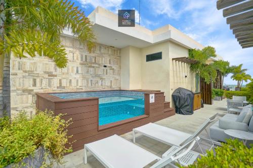 a swimming pool in the backyard of a house at Monaco Residences Piantini in Santo Domingo