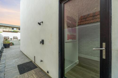 a sliding glass door to a patio with a window at Private Beachside Home with HotTub in Carlsbad