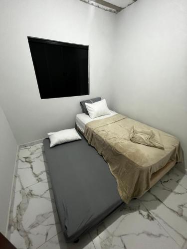 Ένα ή περισσότερα κρεβάτια σε δωμάτιο στο Casa sucupira