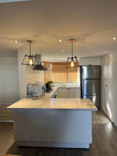 a kitchen with a counter and a refrigerator at Condominio Marina Vallarta in Puerto Vallarta