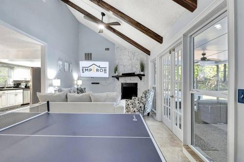 a living room with a ping pong table at Stunning Lake House with Heated Pool & Ping Pong! in Lutz