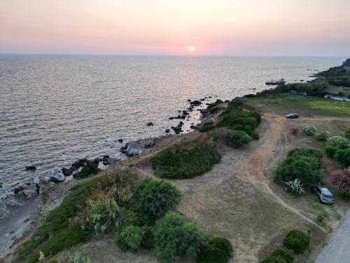 an island in the ocean at sunset at Ionian Moon 1 in Preveza