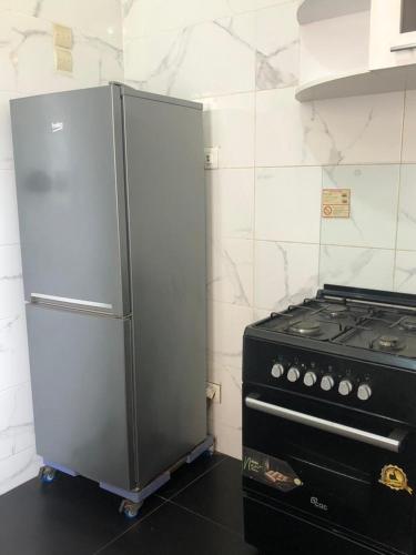 Η κουζίνα ή μικρή κουζίνα στο APPARTEMENT MEUBLE DAKAR Suite 3